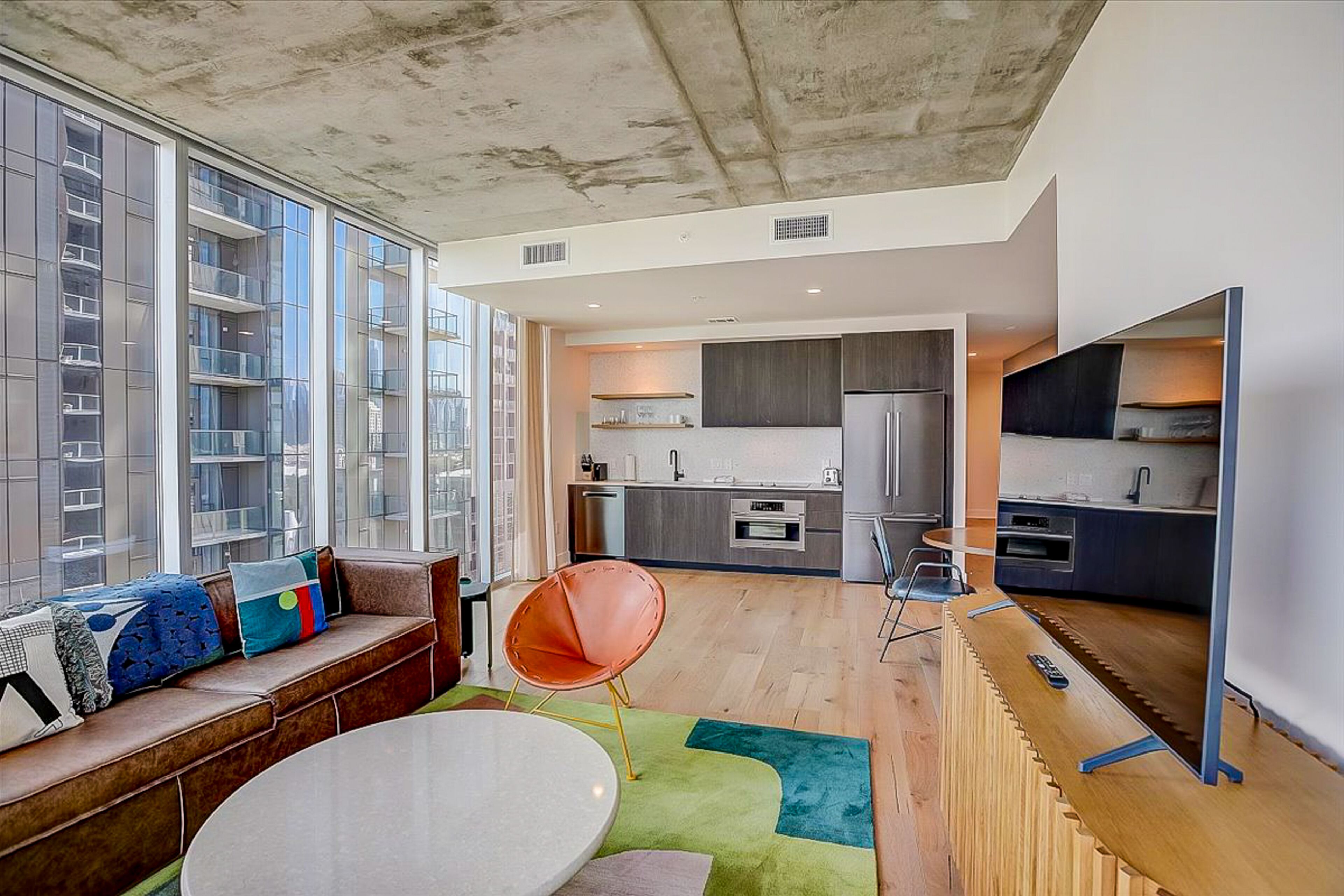 Brand new condo with pool, gym, fast WiFi, central AC, & private washer/dryer