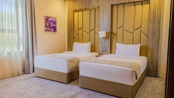 Habitación Deluxe, 2 camas individuales | Sábanas de algodón egipcio, ropa de cama de alta calidad y wifi gratis