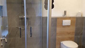 Shower, towels, soap, toilet paper