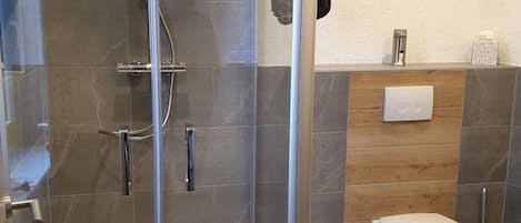 Shower, towels, soap, toilet paper