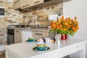 Fridge, microwave, stovetop, coffee/tea maker