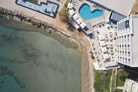 On the beach, beach towels. NLH MATI Seafront - Neighborhood Lifestyle Hotels