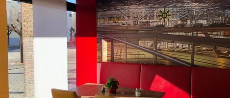A restaurant with a view of a sports stadium.
