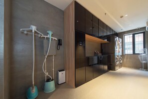 A modern bathroom with a shower, a toilet, and a sink.
