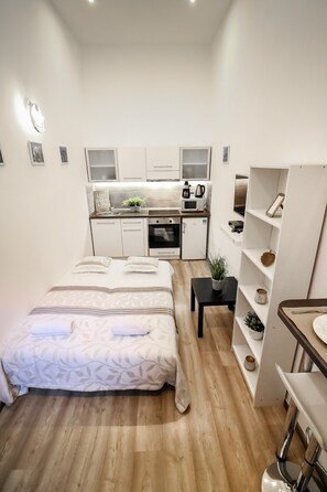 Junior Apartment | Living area | 32-inch LED TV with digital channels, TV - Real Apartments Klauzal II (Budapest)