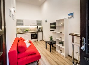 Junior Apartment | Living area | 32-inch LED TV with digital channels, TV - Real Apartments Klauzal II (Budapest)