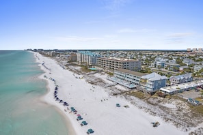 A coastal hotel with a beach view, multiple floors, and a pool area. - Gulf View ~ Beach Setup Included ~ Crystal Beach (Destin)
