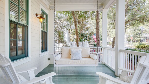 A porch with a white swing chair, a white rocking chair, and a white bench. - Gorgeous Watercolor Home Close to  Camp with NEW 6  "LSV" Low Speed Vehicle. (SANTA ROSA BEACH)