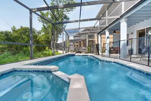 A private heated pool with a screened lanai and comfortable lounge area. - Disney-Themed Villa with Heated Pool & Playroom (Davenport)