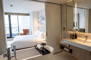 Separate bathtub and shower, free toiletries, hair dryer, bathrobes