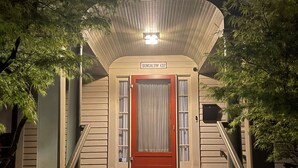 A bungalow with a red door, a covered porch, and a staircase leading to the entrance. - Welcome to Bungalow 437! Close to Downtown & OSU!  (Corvallis)