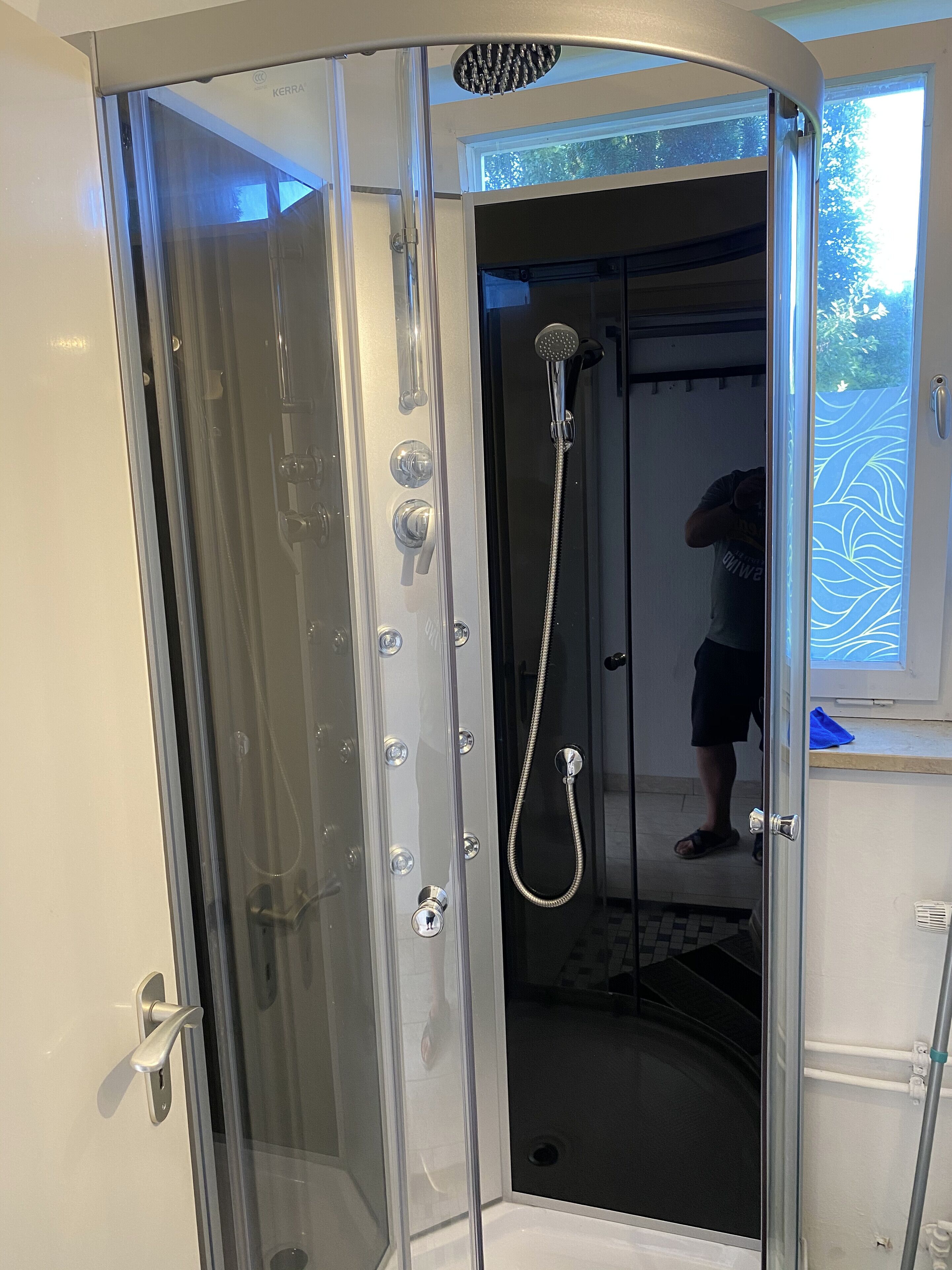 Shower, hair dryer, towels, toilet paper