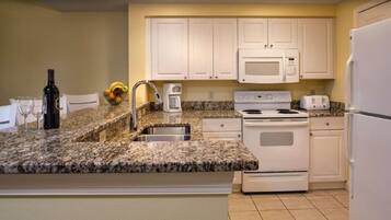 Microwave, dishwasher, coffee/tea maker, cookware/dishes/utensils