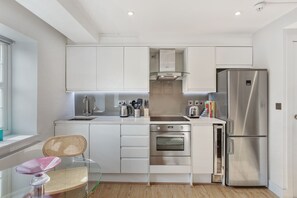 Apartment, 1 Bedroom | Private kitchen | Full-sized fridge, microwave, oven, dishwasher - Cleveland Street by Aeria Apartments (London)