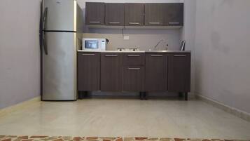 Fridge, microwave, stovetop, coffee/tea maker