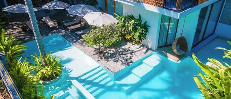 2 indoor pools, outdoor pool, open 9:00 AM to 9:30 PM, pool umbrellas