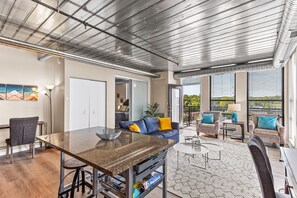 City Apartment | Living area | 55-inch Smart TV with digital channels, TV, streaming services - Ann Arbor City Club Apartments (Ann Arbor)