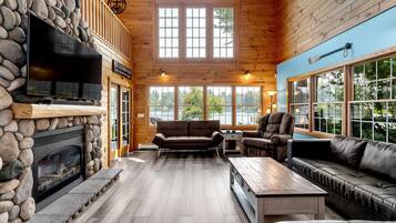 TV connectée, cheminée, lecteur de DVD, table de tennis de table