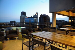 A rooftop terrace with outdoor seating and a city skyline view. - Chic Pet-Friendly Studio with Hotel-Like Amenities (Toledo)