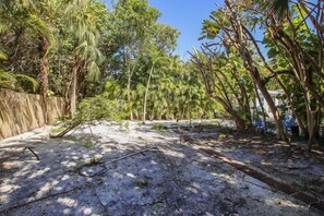 Surrounded by lush tropical foliage, this serene outdoor space offers a peaceful retreat.
