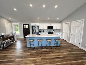Enjoy cooking in this well-equipped kitchen with a central island and modern appliances.