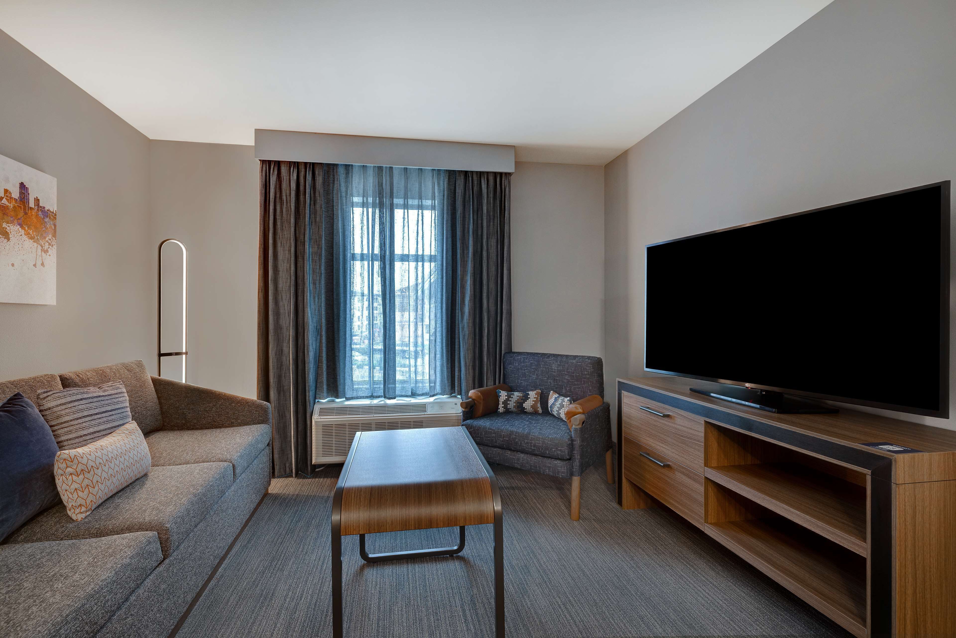 suite, 1 bedroom | living area | 50-inch smart tv with cable channels, tv