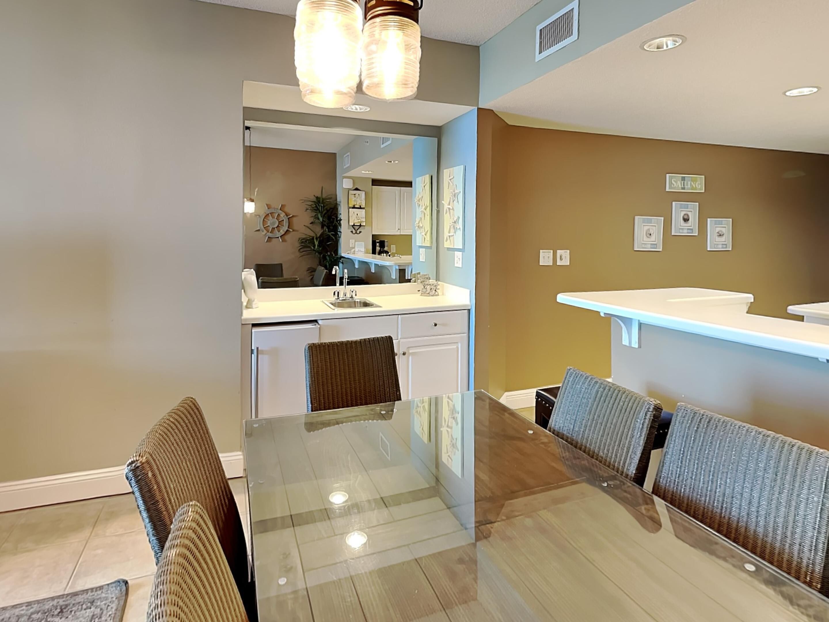A modern kitchen with a dining area.