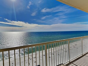 A balcony with a view of a beach and ocean. - Majestic Beach Resort II by Resort Collection (Panama City Beach)