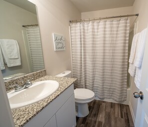 Combined shower/bathtub, soap, shampoo, toilet paper