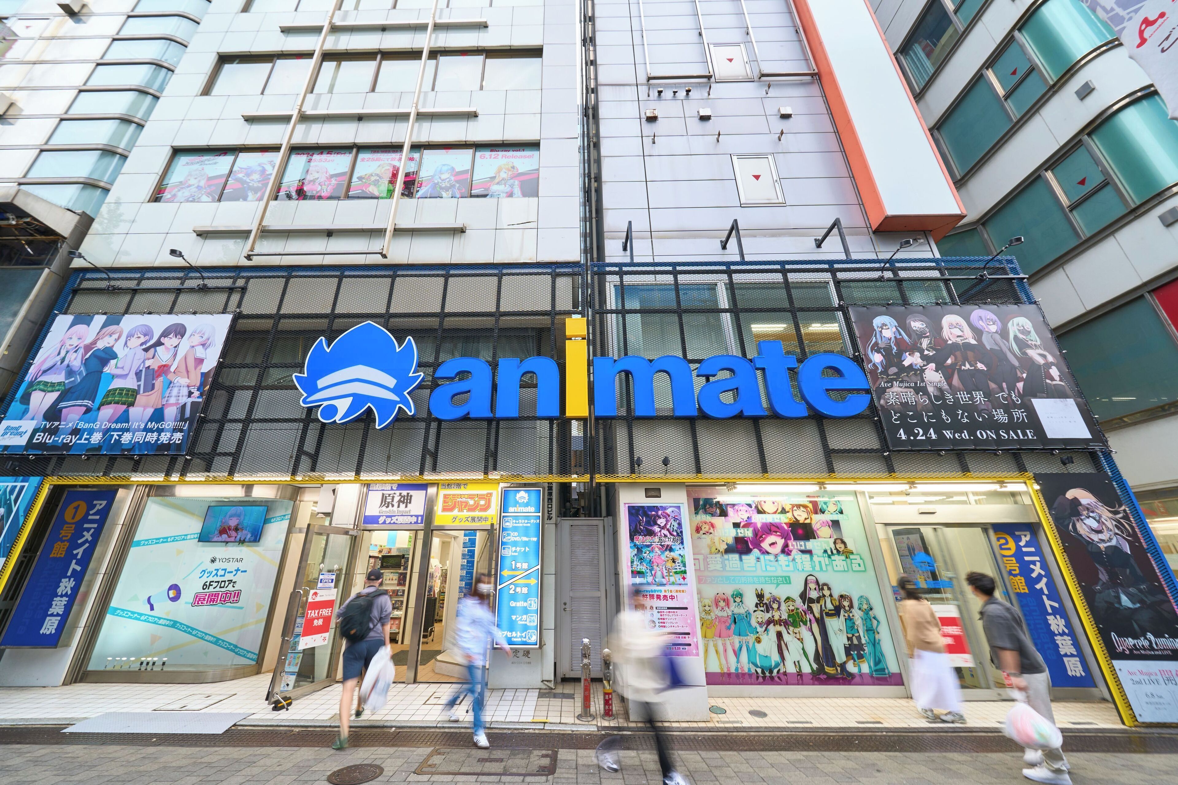 A building with a storefront labeled "animate" featuring anime posters and a large blue logo.