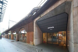 A building with a modern facade, featuring a prominent 'MAACH' sign. - Hotel Resol Stay Akihabara (Tokyo)
