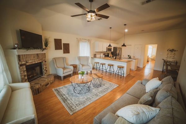 Stylish but cozy living space with lots of seating and modern farmhouse touches.