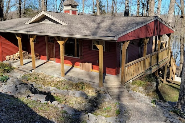 view of home as you arrive. covered porch with wrap around on three sides
