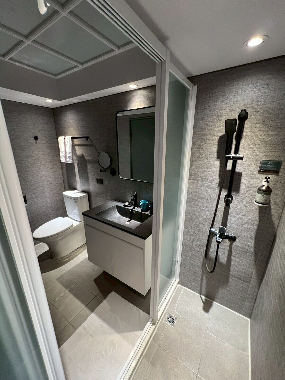 Rainfall showerhead, hair dryer, slippers, towels