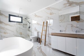 Bathtub, hair dryer, towels