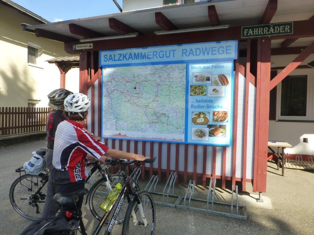 A map and food menu at a roadside cafe named 'Fahrräder'.