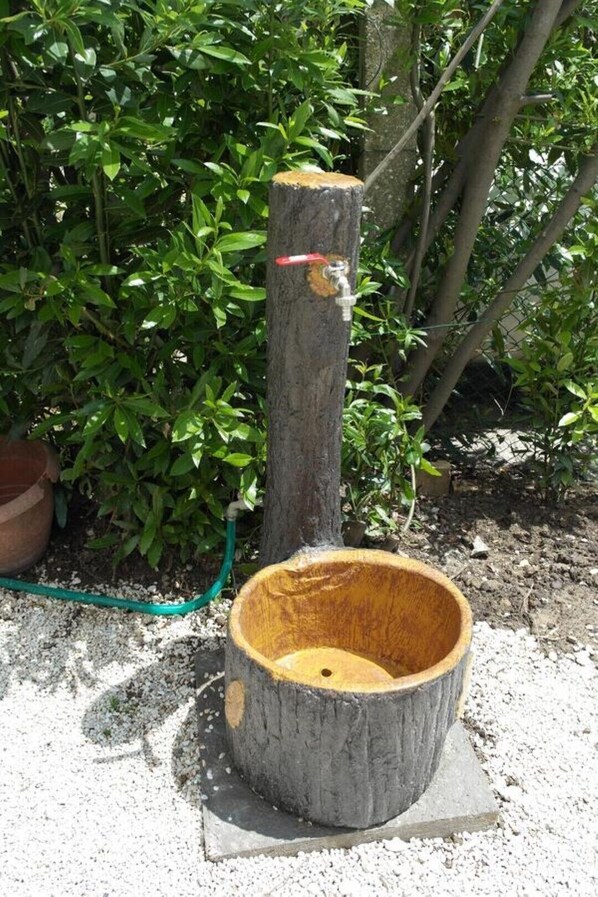 Watering station in a serene garden setting.