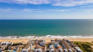 On the beach, sun loungers, beach towels