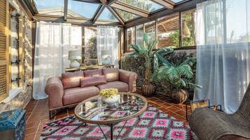 Villa Adonis | Living area | 52-inch Smart TV with satellite channels, TV, Netflix
