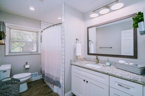Combined shower/bathtub, hair dryer, towels, soap