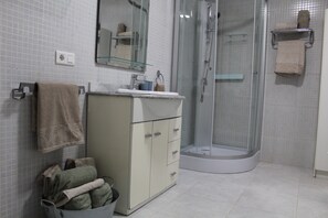 Shower, hair dryer, towels, soap