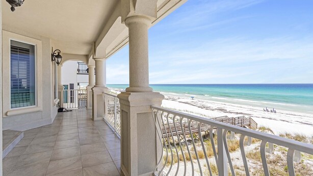 A covered balcony with a view of the beach and ocean. - Kings View|Private Beach Access|Gulf Front Home with Stunning Gulf Views (Destin)
