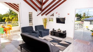 Family Apartment, 2 Bedrooms, Terrace, Garden Area | Living area | 40-cm Smart TV with digital channels, TV, toys
