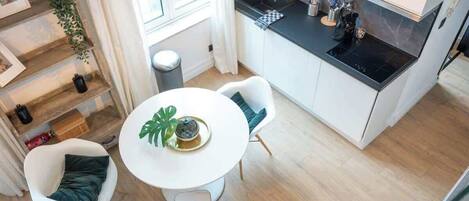 Fridge, microwave, coffee/tea maker, cookware/dishes/utensils