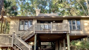 A two-story house with a balcony and a staircase leading to the upper floor. - 3 bed/3 bath Inlet Cove cottage, ON KIAWAH! community pool, short walk to beach (Johns Island)