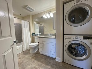 Bathtub, hair dryer, towels