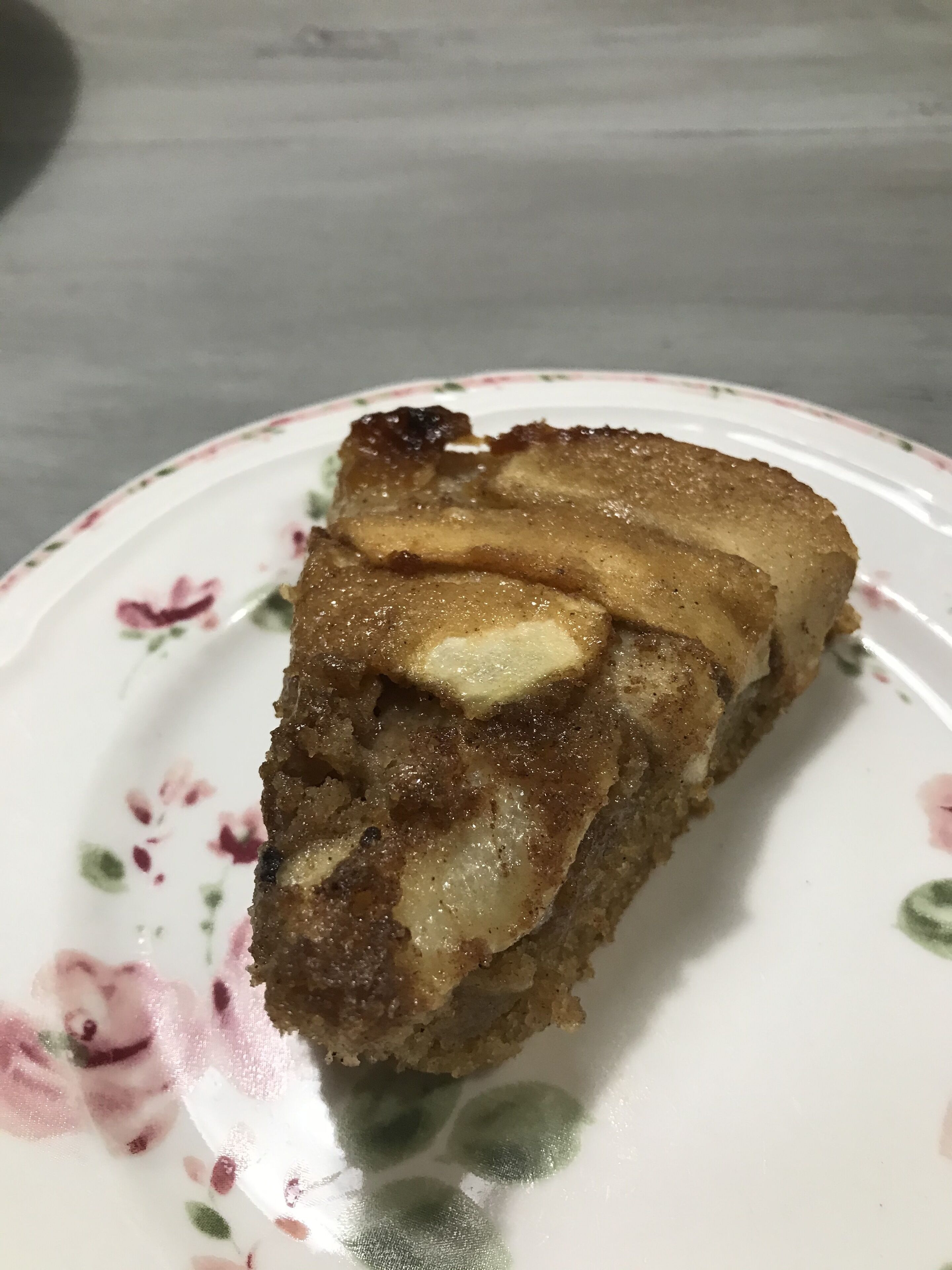 A slice of cake on a floral plate.
