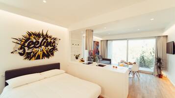 Deluxe Studio Suite | Living area | 43-inch Smart TV with digital channels, TV