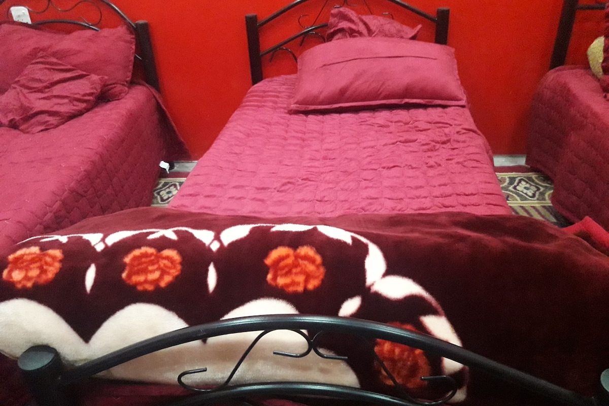 Premium bedding, memory foam beds, laptop workspace, blackout drapes
