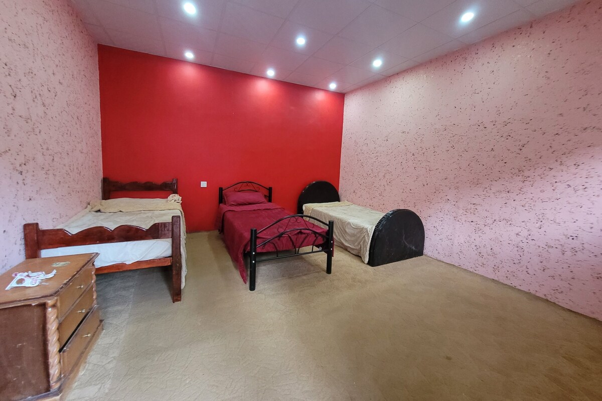 Premium bedding, memory foam beds, laptop workspace, blackout drapes
